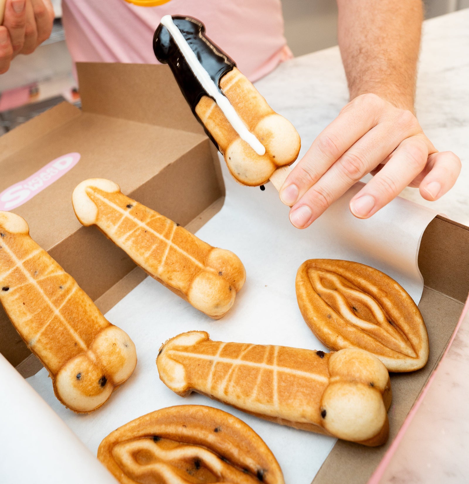 Sugar Wood Both Ways Kit contents — naughty waffles, sauces, sprinkles, and decorating supplies